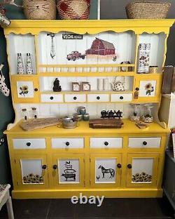 Large farmhouse Welsh dresser painted in daisy (yellow) and white. On the farm