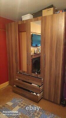 Sharps 4 door wardrobe with 2 mirrors, 3 large drawers in a walnut wood finish